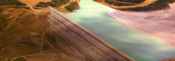 Large tailings dam holding back water