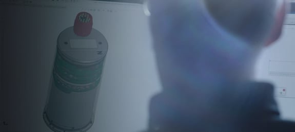 Man working on a seismometer design in Autocad