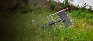 Downed seismic station, laying in the grass