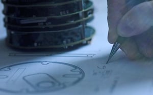 Technician drafting a seismometer design