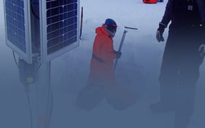 Scientists installing seismic equipment in the snow