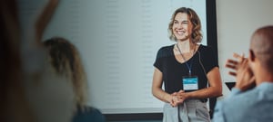 Woman presenting in front of screen