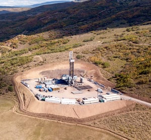 Fracking tower on an oil drilling site in the hills