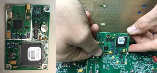 Hands replacing a gps module on a circuit board